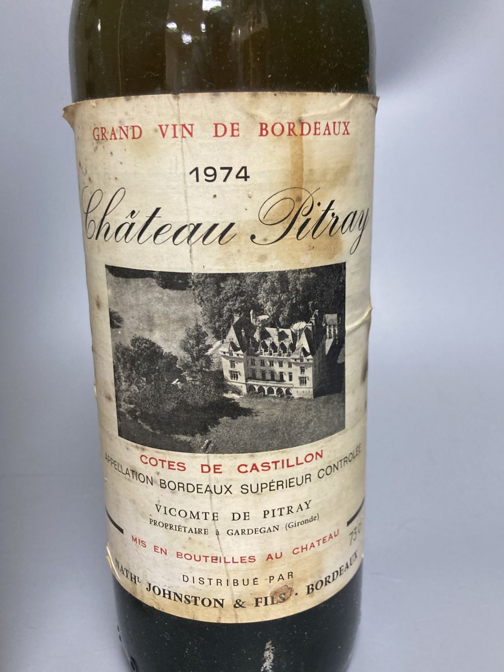 One bottle of Dows Christmas Port and a bottle of Chateau Pitray 1974